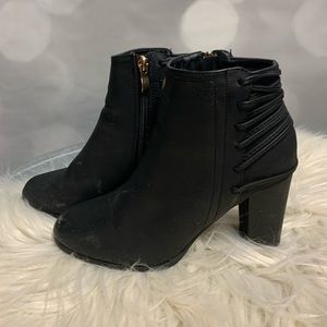 Black booties by Free Reign with faux leather cording up heel. Size 7M
